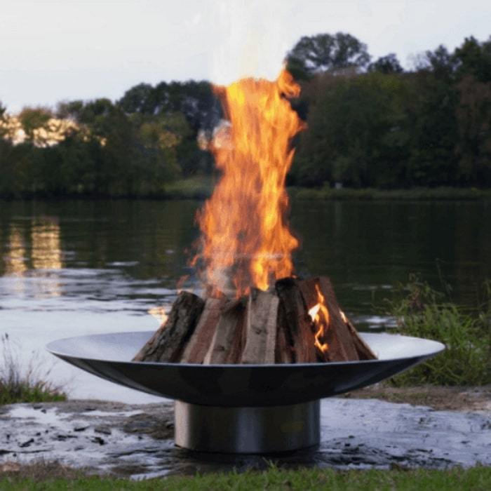 Bella Vita 34" Stainless Steel Fire Pit by Fire Pit Art with Pond Background