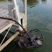 Industrial Mount attached to dock above water.