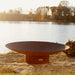 Asia 72" Fire Pit by Fire Pit Art with Pond and Tress Background