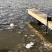 Power House Ice Eater Dock Mount attached to a deck and in the water.