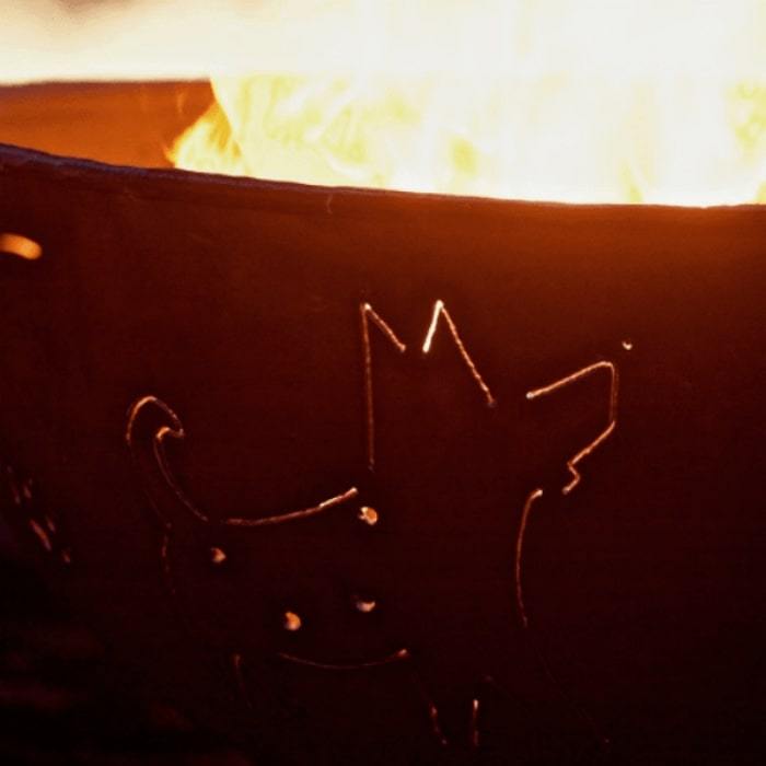 Funky Dog 36" Steel Fire Pit by Fire Pit Art with a Close up Image of the Dog