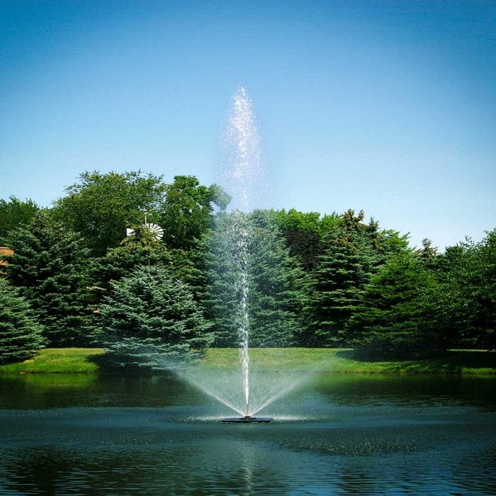 Scott Aerator Skyward Pond Fountain 1.5HP 230V with a Pine Trees Background