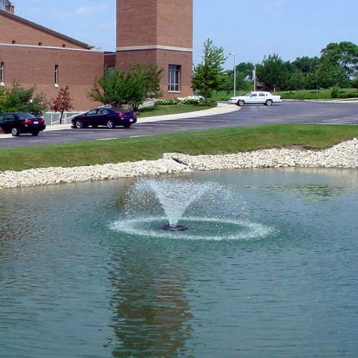 Kasco 3400HVFX 3/4HP 240V Pond Aerator Fountain with Cars and Building Background