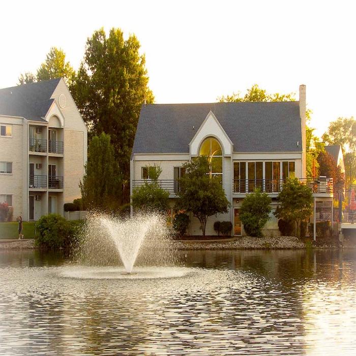 Image of the Scott Aerator DA-20 Display Fountain Aerator 2HP Shooting Water at the Pond with Houses