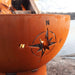 Navigator 36" Steel Fire Pit by Fire Pit Art with a  Focused Image of Half Side of the Pit