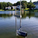 Scott Aerator Dock Mount Pond De-Icer [10000] With Houses and Trees Background