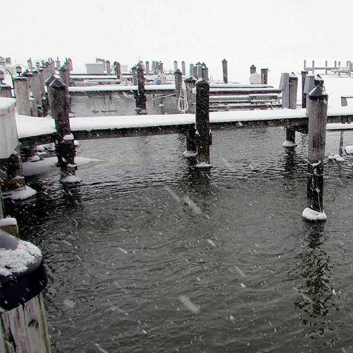 Scott Aerator Floating Pond De-Icer [12000] with Raining Snow Background